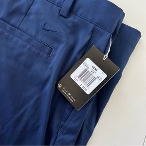 NWT Nike Men’s navy blue golf pants. Size 34/32